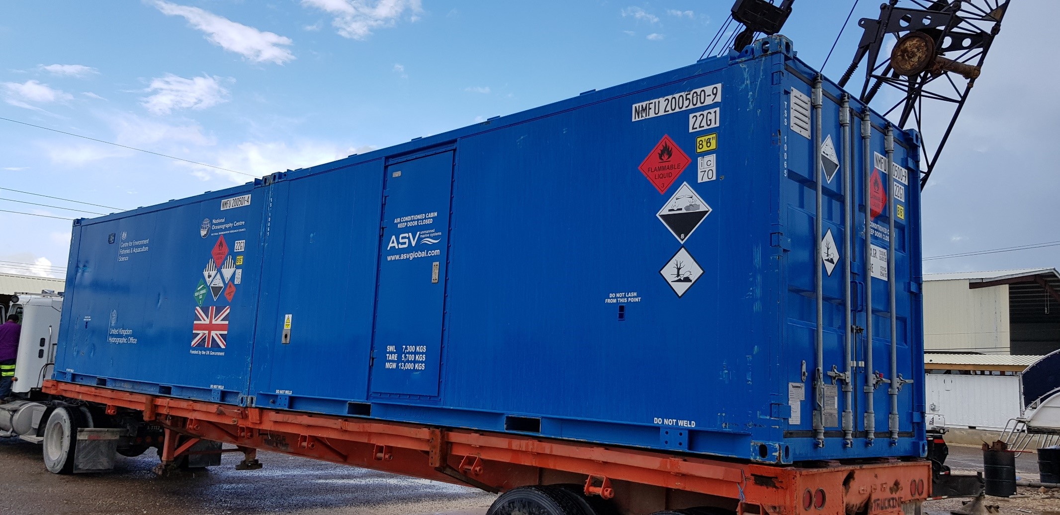 Containers being delivered to site in Belize Marina 2019